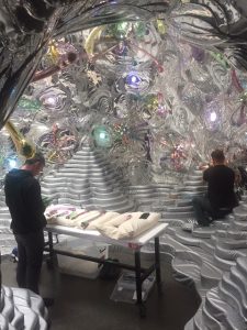 artisans prepare a grotto installation / display